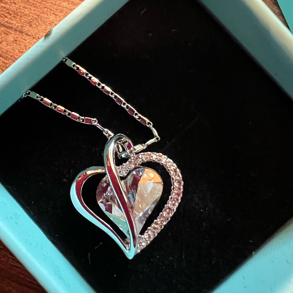 Beautiful, heart pendant, and light, blue, and silver.